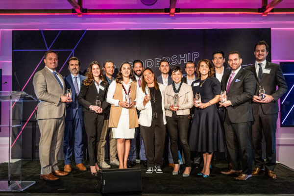 TK6A8509 Members of the Class of 2019 pose onstage with their awards at the 2019 Alumni Society Leadership Summit